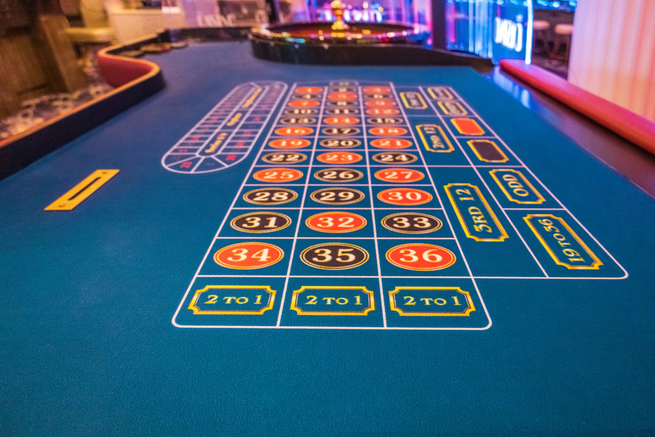 Casino roulette table with betting layout.